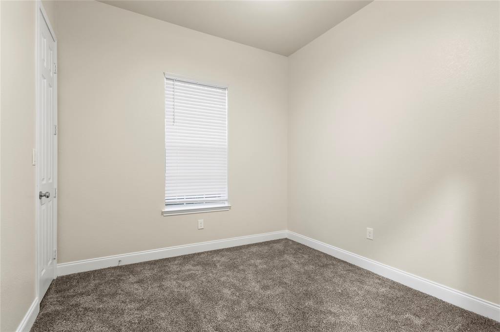 503 South 5th Street Bonham, TX 75418 - Photo 16 of 22 an empty room with a window