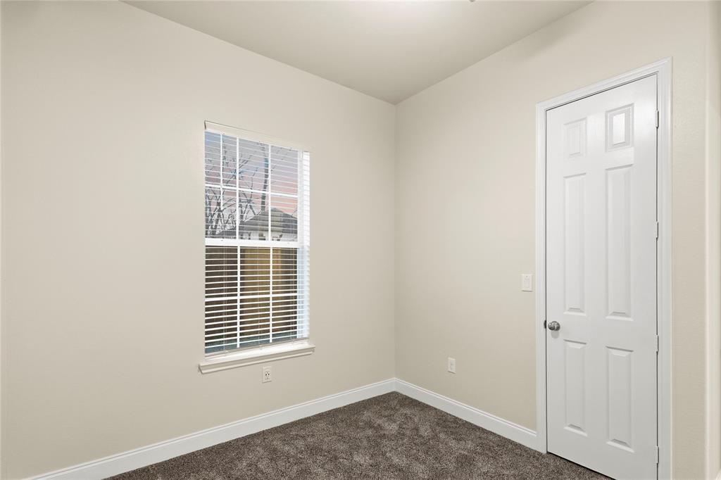503 South 5th Street Bonham, TX 75418 - Photo 17 of 22 a view of an empty room with a window