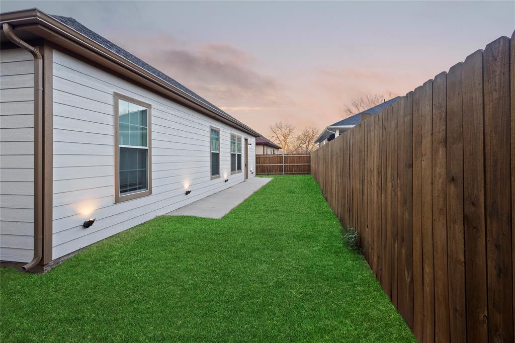 503 South 5th Street Bonham, TX 75418 - Photo 19 of 22 a view of a back yard of the house