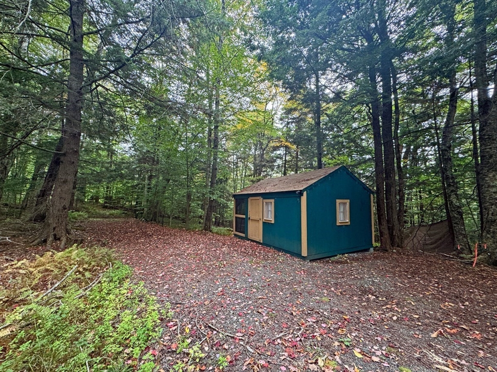 60 Stone Hill Road Rowe, MA 01367 - Photo 2 of 28 a view of a house with a backyard