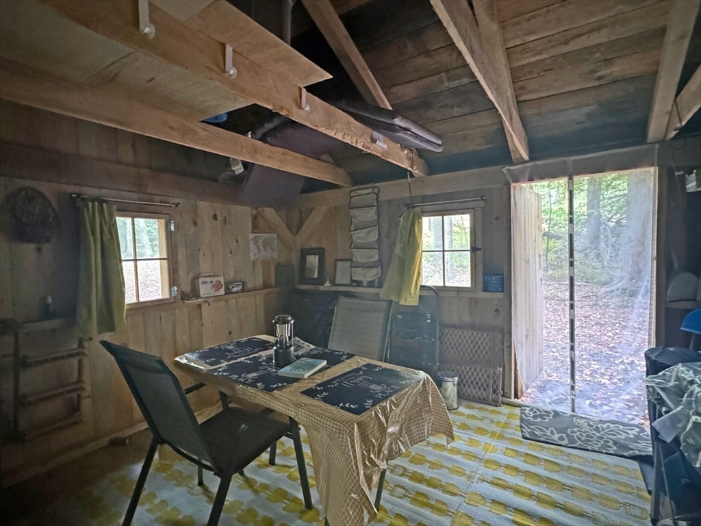 60 Stone Hill Road Rowe, MA 01367 - Photo 22 of 28 a dinning room with a table and chairs