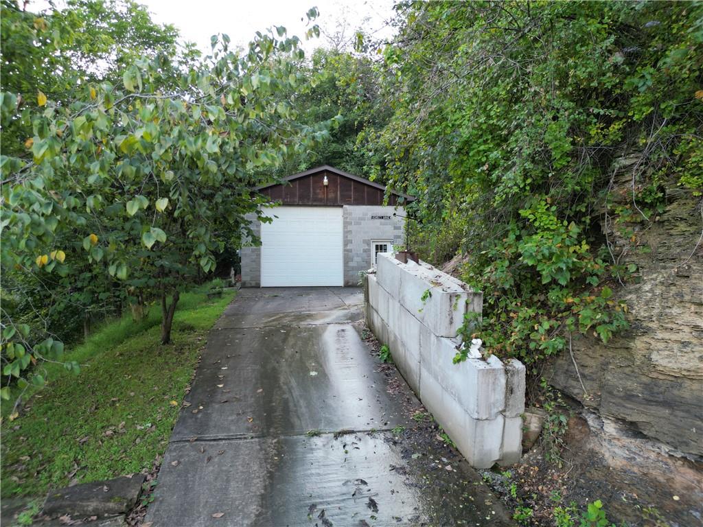 796 Rte 481 Monongahela, PA 15063 - Photo 19 of 26 MASSIVE 31x22 Detached Garage w/ 12ft Doors, man door, office area, Glass Block Windows, Updated Breaker Box & Oil Heat Furnace! 6 inches of concrete on upper part of driveway and 4" for lower part for all the heavy duty traffic