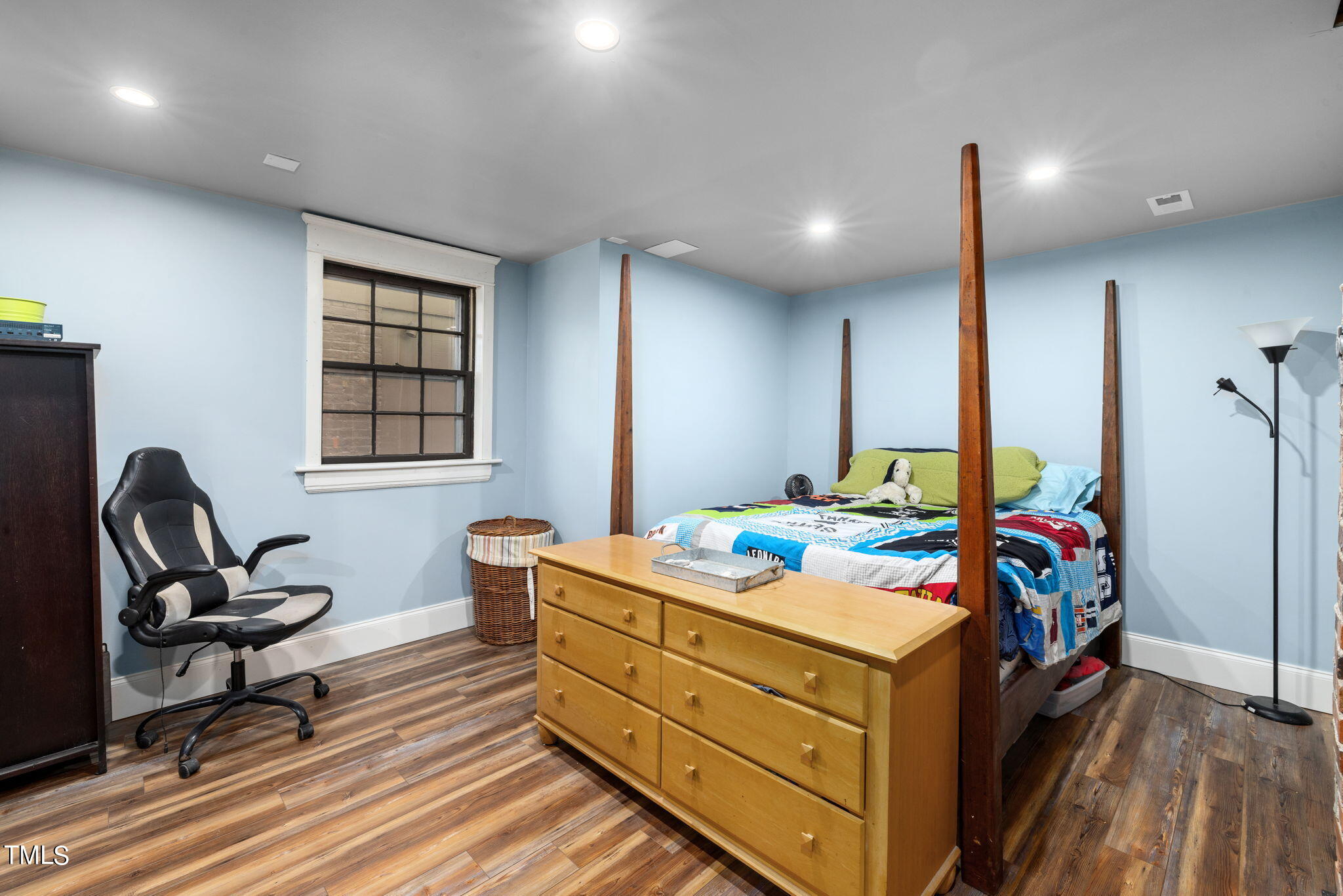 601 East Lane Street Raleigh, NC 27601 - Photo 26 of 34 a bed room with a bed and furniture