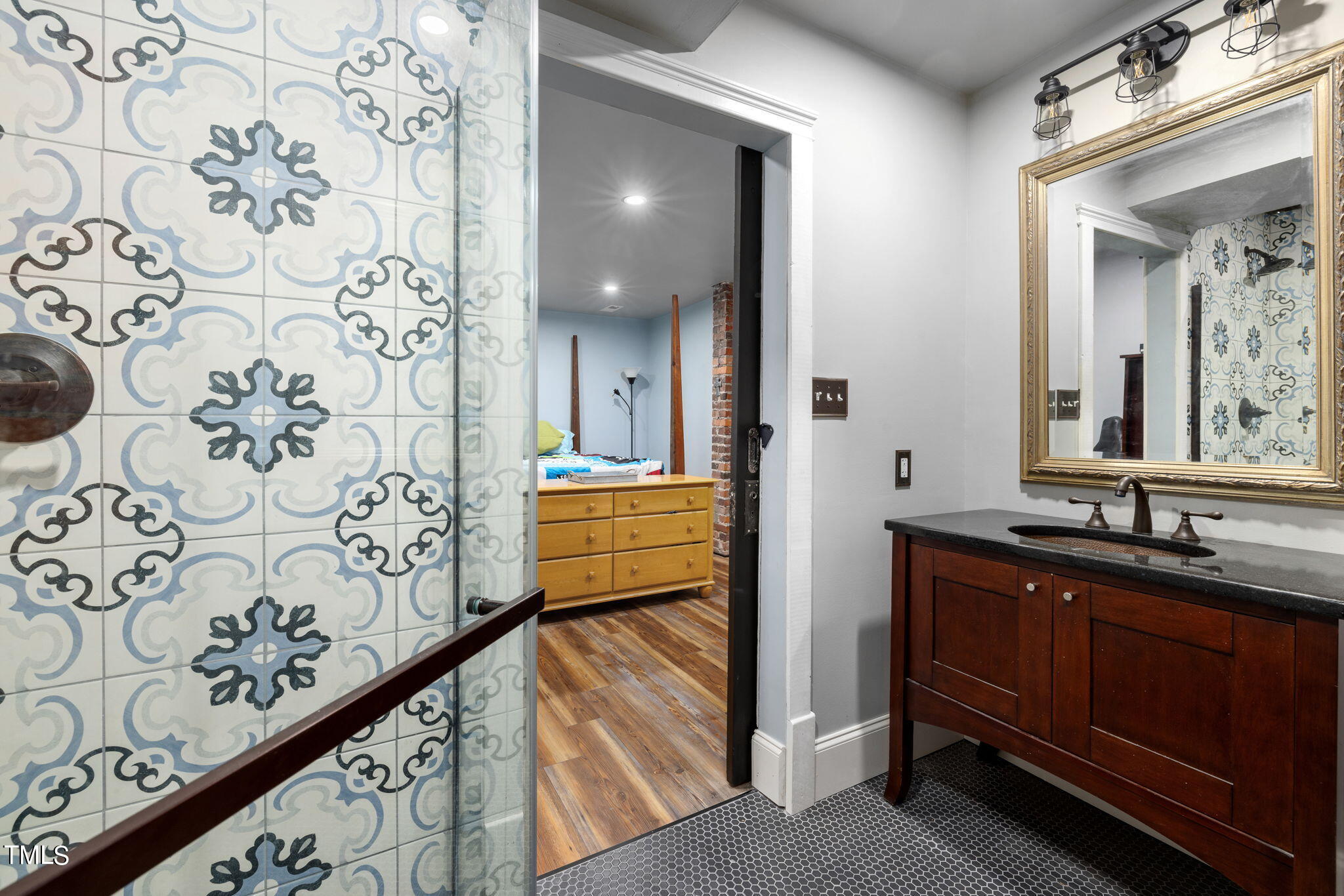 601 East Lane Street Raleigh, NC 27601 - Photo 28 of 34 a bathroom with a sink and a mirror
