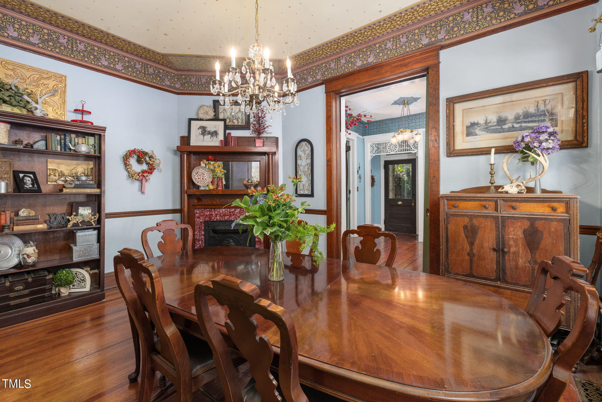 601 East Lane Street Raleigh, NC 27601 - Photo 9 of 34 a dining room with furniture a livingroom and chandelier