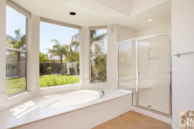 5 Champagne Circle Rancho Mirage, CA 92270 - Photo 15 of 24 a bathroom with a bathtub and a shower