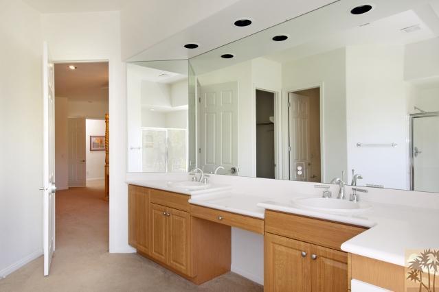 5 Champagne Circle Rancho Mirage, CA 92270 - Photo 16 of 24 a bathroom with a double vanity sink mirror and double