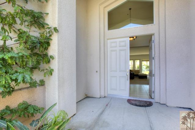 5 Champagne Circle Rancho Mirage, CA 92270 - Photo 2 of 24 an empty room with potted plants