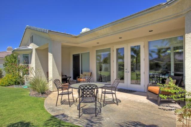 5 Champagne Circle Rancho Mirage, CA 92270 - Photo 21 of 24 a view of a patio with table and chairs and potted plants