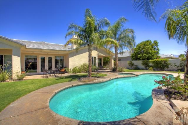 5 Champagne Circle Rancho Mirage, CA 92270 - Photo 22 of 24 a view of a house with swimming pool and a yard