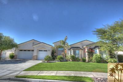 5 Champagne Circle Rancho Mirage, CA 92270 - Photo 24 of 24 a front view of a house with a yard and garage