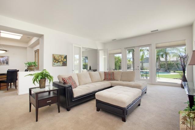 5 Champagne Circle Rancho Mirage, CA 92270 - Photo 4 of 24 a living room with furniture and a large window