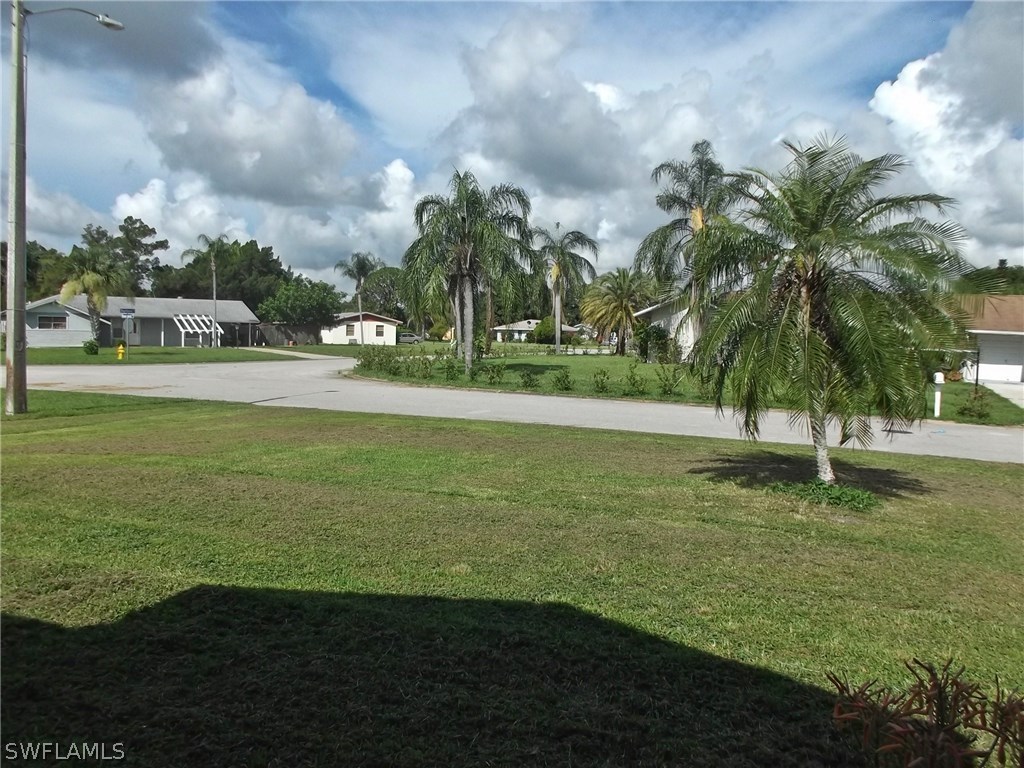 108 Rowland Road Lehigh Acres, FL 33936 - Photo 2 of 8 a view of a yard with a fountain