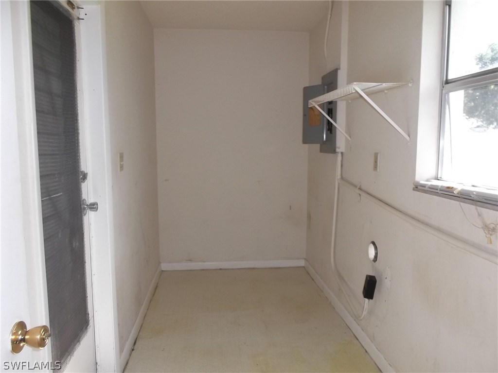 108 Rowland Road Lehigh Acres, FL 33936 - Photo 8 of 8 a view of small space with racks on the wall