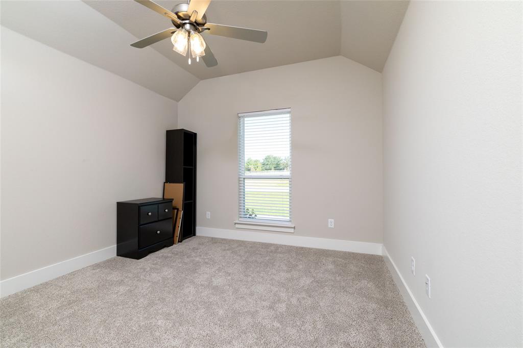 321 Monument Pl. Azle, TX 76020 - Photo 27 of 38 an empty room with closet and a chandelier fan