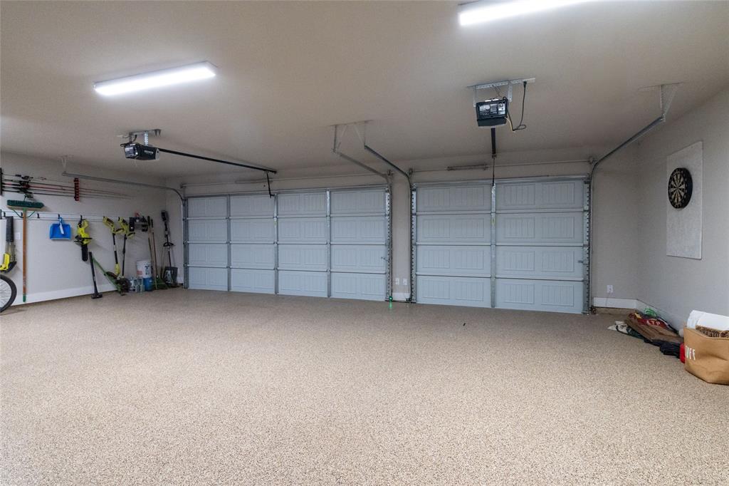 321 Monument Pl. Azle, TX 76020 - Photo 29 of 37 Garage with a garage door opener