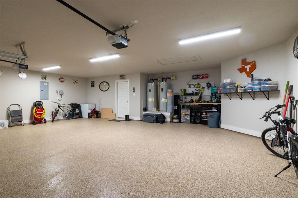 321 Monument Pl. Azle, TX 76020 - Photo 32 of 38 a view of a garage with furniture and a fan