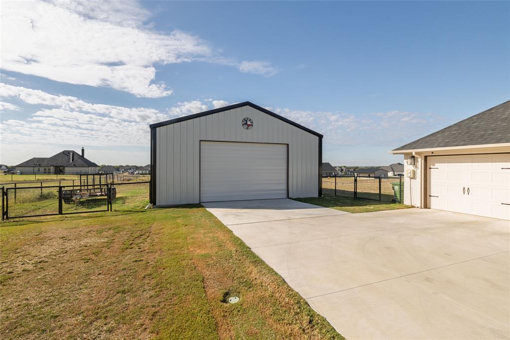 321 Monument Pl. Azle, TX 76020 - Photo 32 of 37 Detached garage with a gate