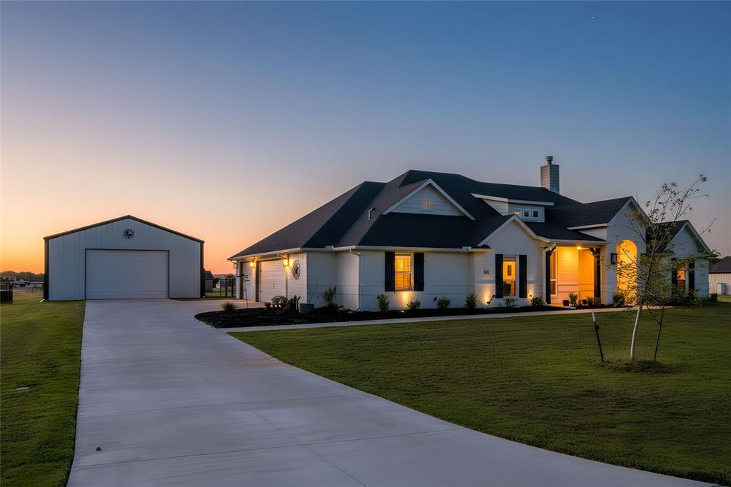 321 Monument Pl. Azle, TX 76020 - Photo 37 of 38 a front view of a house with a yard