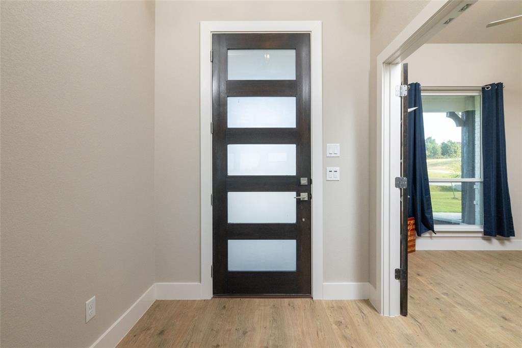 321 Monument Pl. Azle, TX 76020 - Photo 5 of 37 Foyer entrance with light wood-style floors
