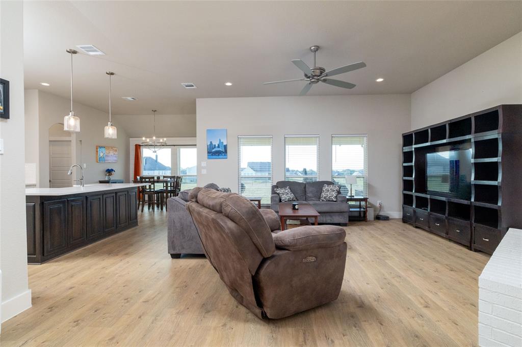 321 Monument Pl. Azle, TX 76020 - Photo 7 of 38 a living room with furniture and a flat screen tv