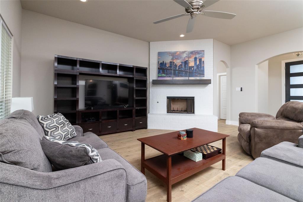 321 Monument Pl. Azle, TX 76020 - Photo 10 of 38 a living room with furniture and a fireplace