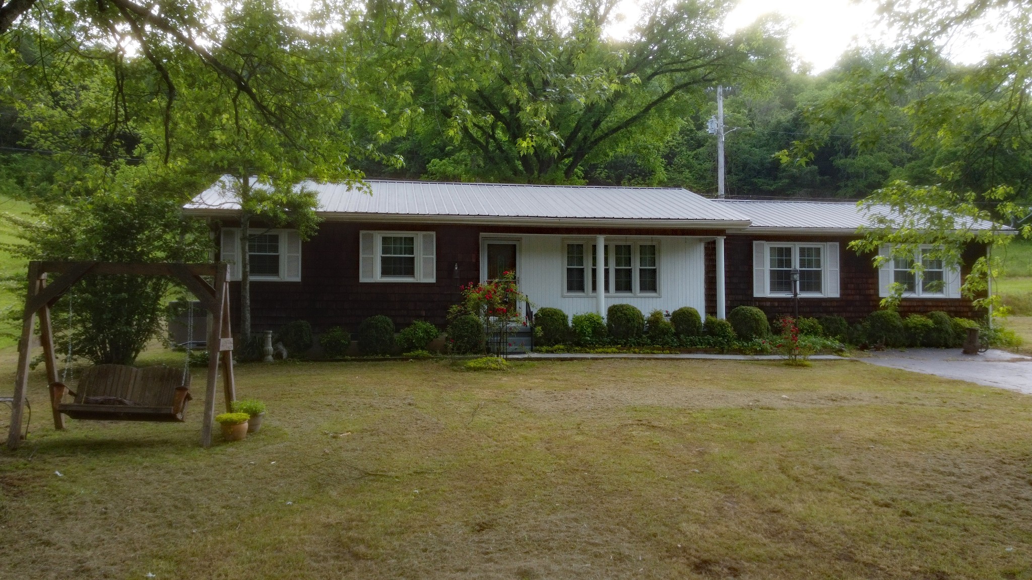 9073 Sherwood Road Sherwood, TN 37376 - Photo 12 of 45 a front view of a house with garden