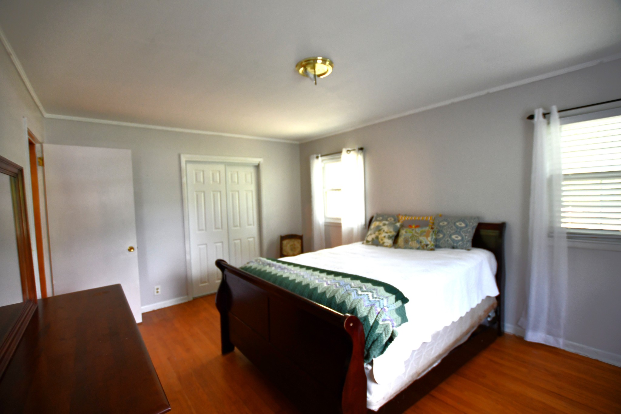 9073 Sherwood Road Sherwood, TN 37376 - Photo 34 of 45 a bedroom with a bed and wooden floor