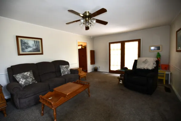 a living room with furniture and a window