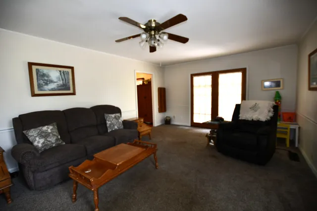 a living room with furniture and a window