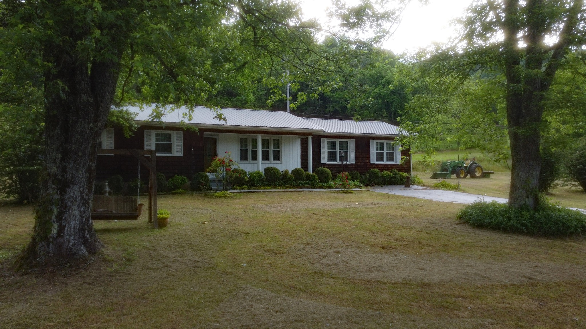 9073 Sherwood Road Sherwood, TN 37376 - Photo 7 of 45 a front view of a house with a yard