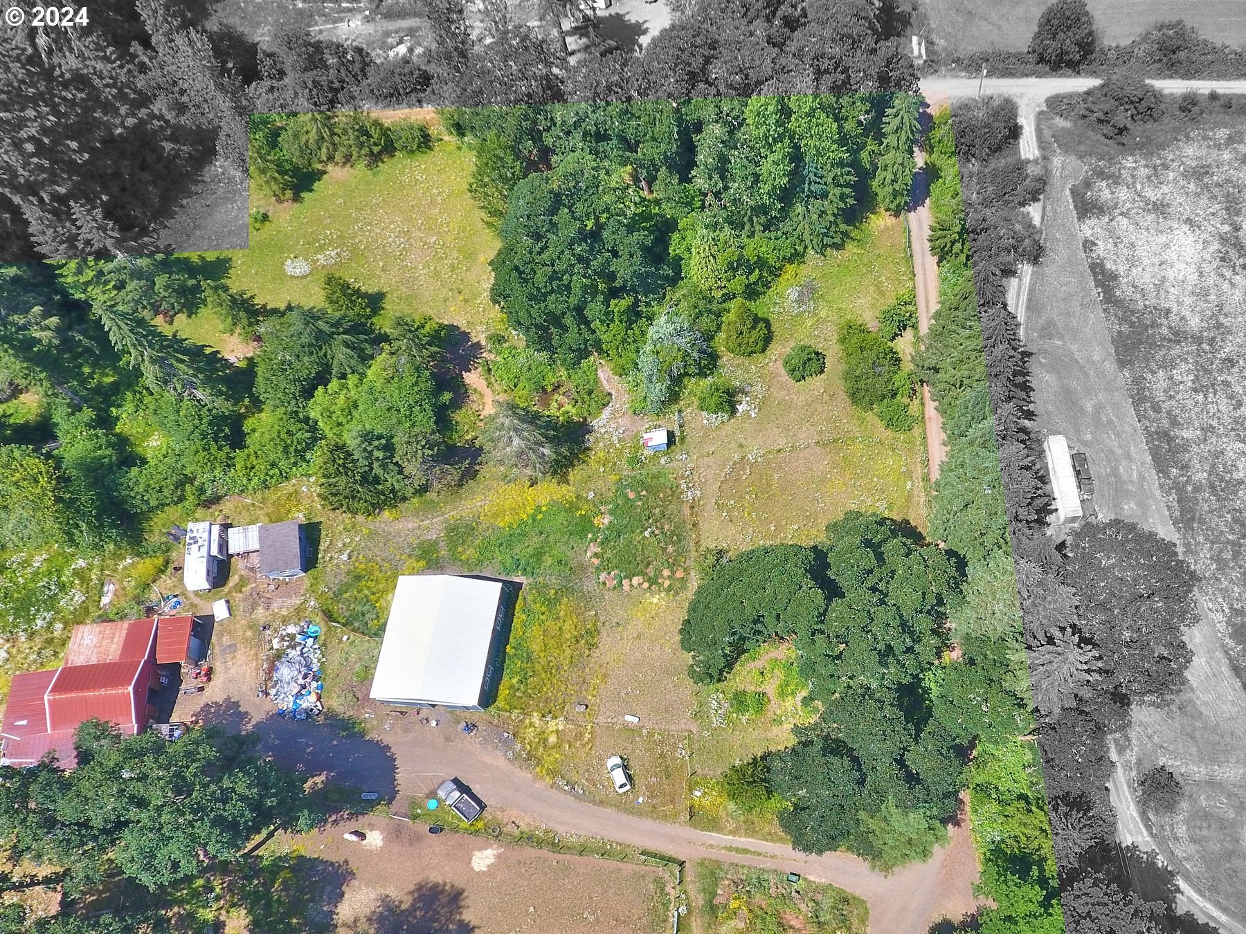 28250 Andy Riggs Road Grand Ronde, OR 97347 - Photo 15 of 48 an aerial view of a house with a yard and lake view