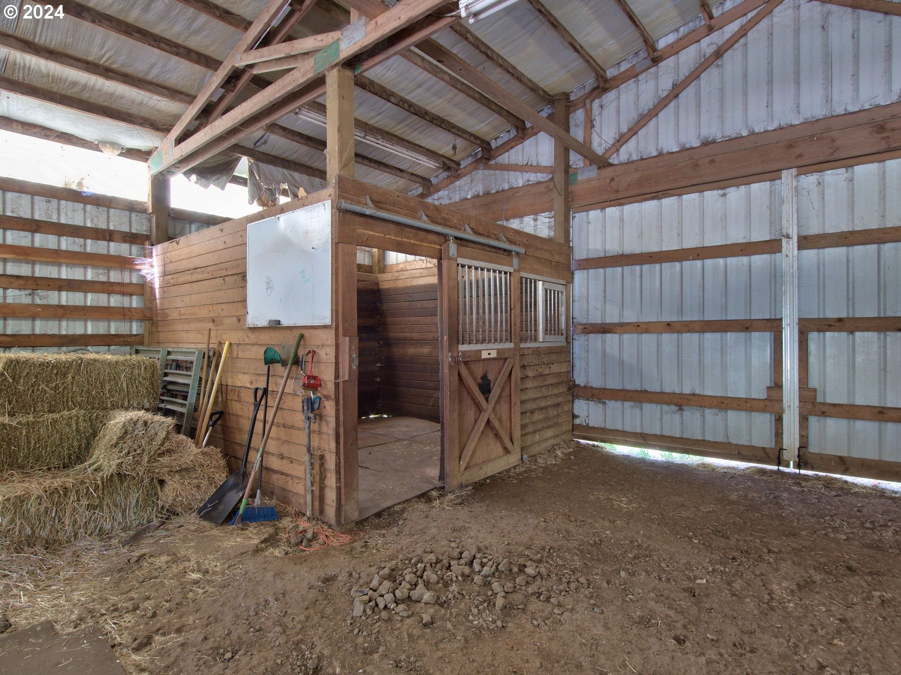 28250 Andy Riggs Road Grand Ronde, OR 97347 - Photo 22 of 48 a view of empty room with wooden walls