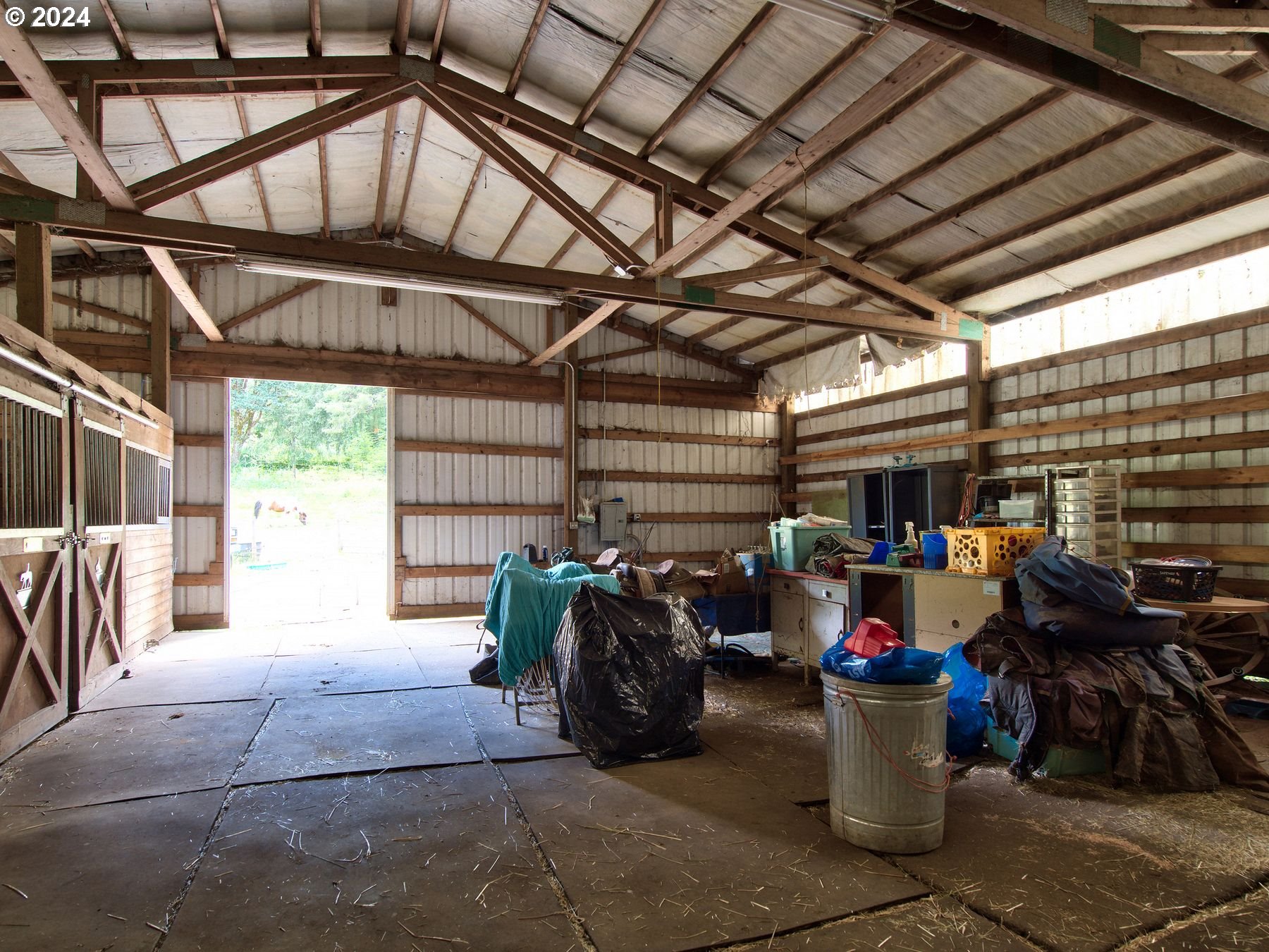 28250 Andy Riggs Road Grand Ronde, OR 97347 - Photo 24 of 48 a view of a garage with a table and chairs