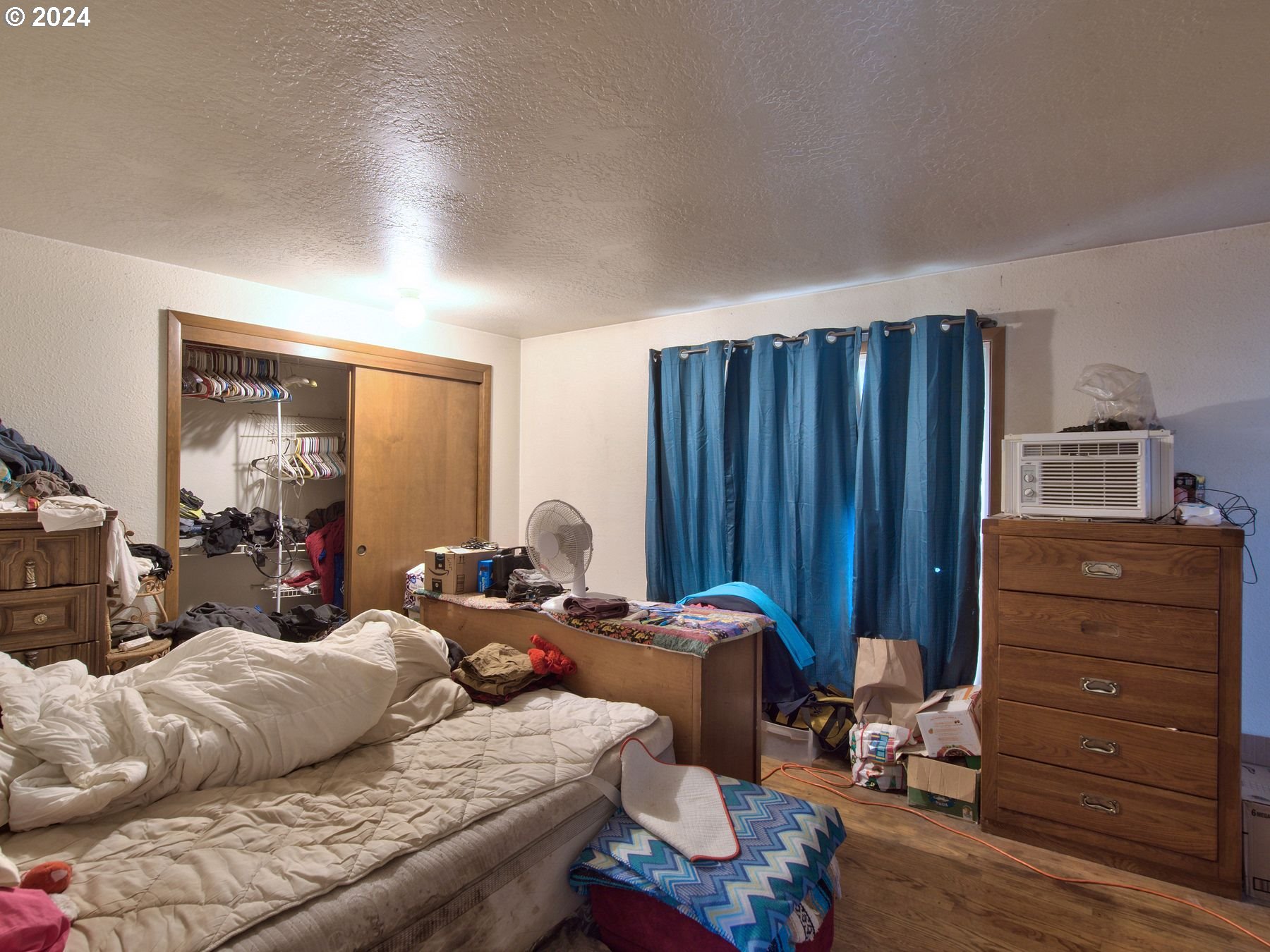28250 Andy Riggs Road Grand Ronde, OR 97347 - Photo 45 of 48 a bedroom with furniture and wooden floor