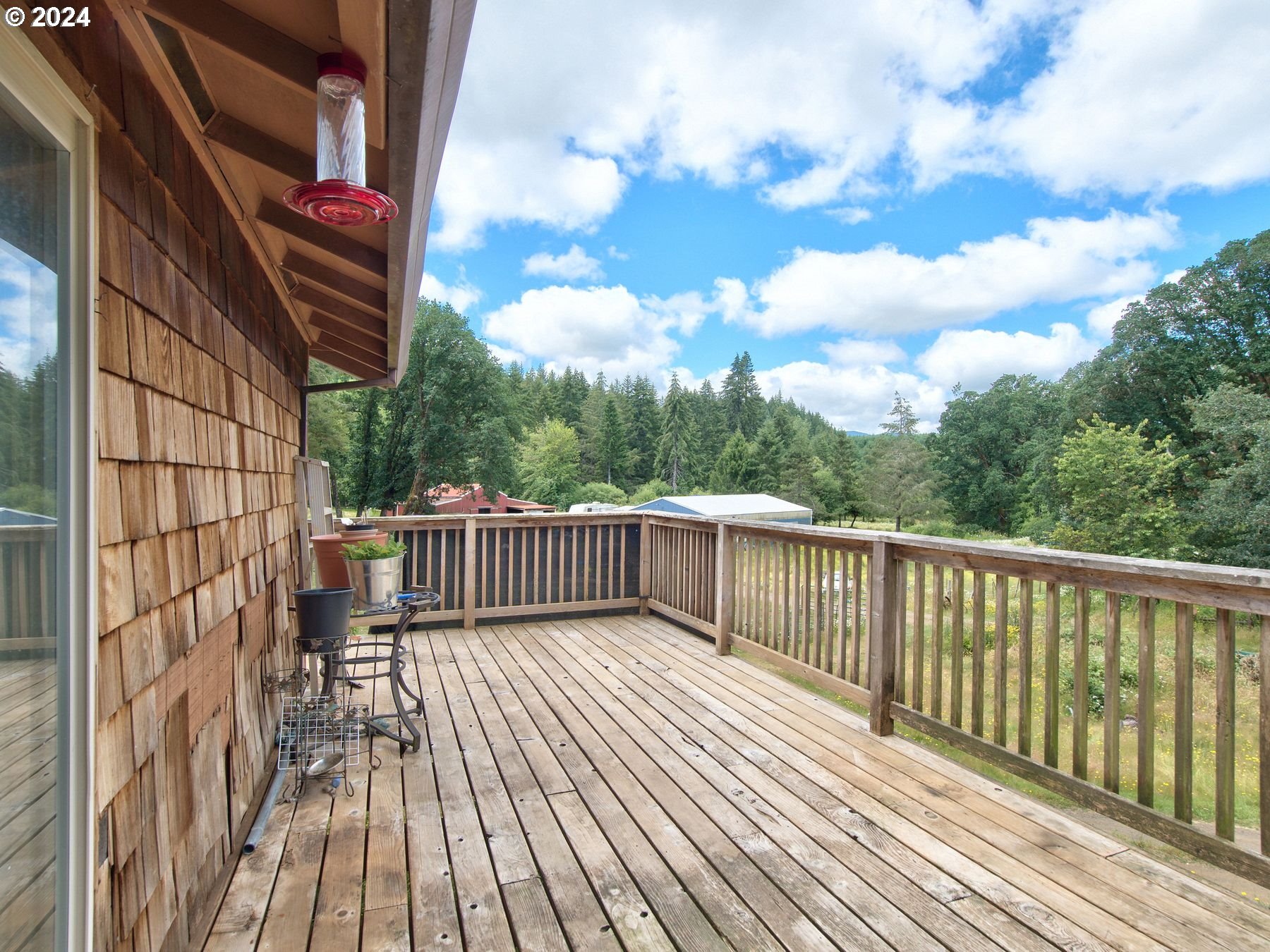 28250 Andy Riggs Road Grand Ronde, OR 97347 - Photo 48 of 48 a view of balcony with wooden floor and fence