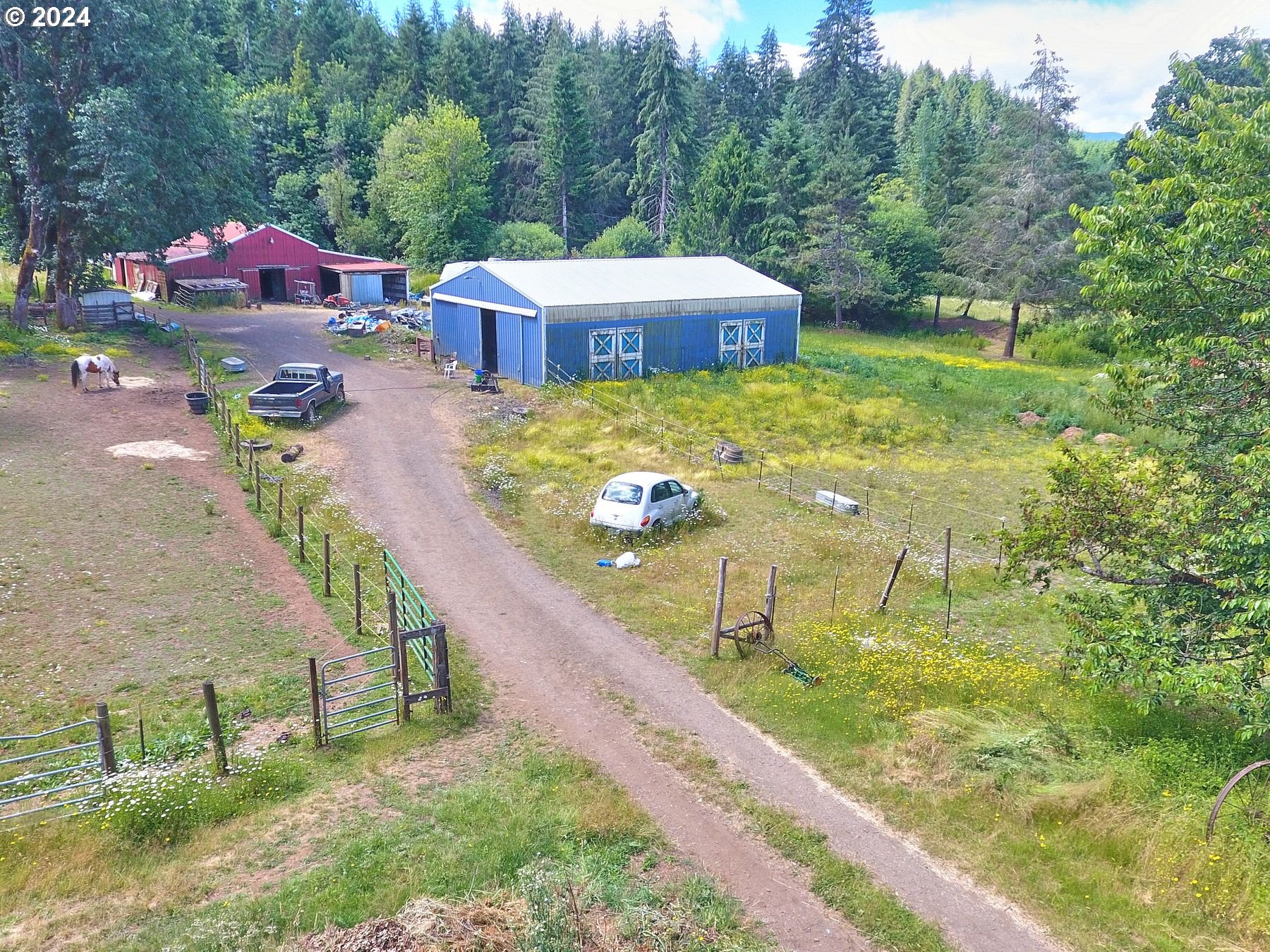 28250 Andy Riggs Road Grand Ronde, OR 97347 - Photo 7 of 48 a view of a swimming pool with a yard