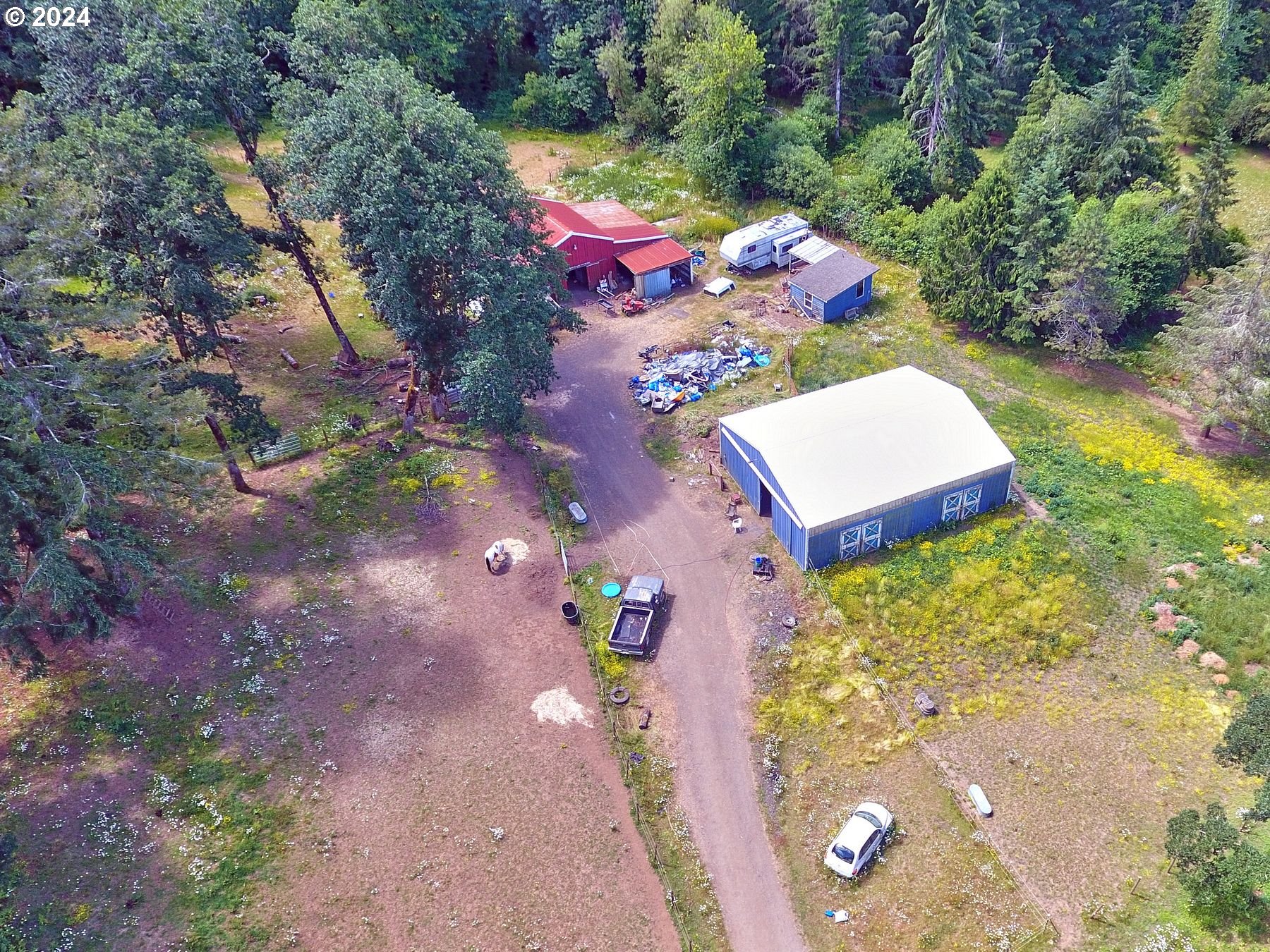 28250 Andy Riggs Road Grand Ronde, OR 97347 - Photo 8 of 48 an aerial view of a house with a yard