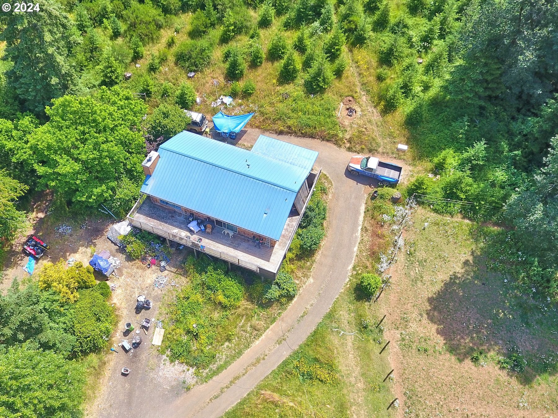 28250 Andy Riggs Road Grand Ronde, OR 97347 - Photo 9 of 48 an aerial view of a house with a yard basket ball court and outdoor seating