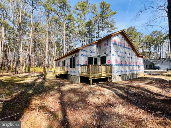 a front view of a house with garage