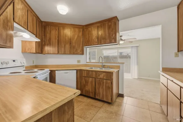 a kitchen with a cabinets and appliances