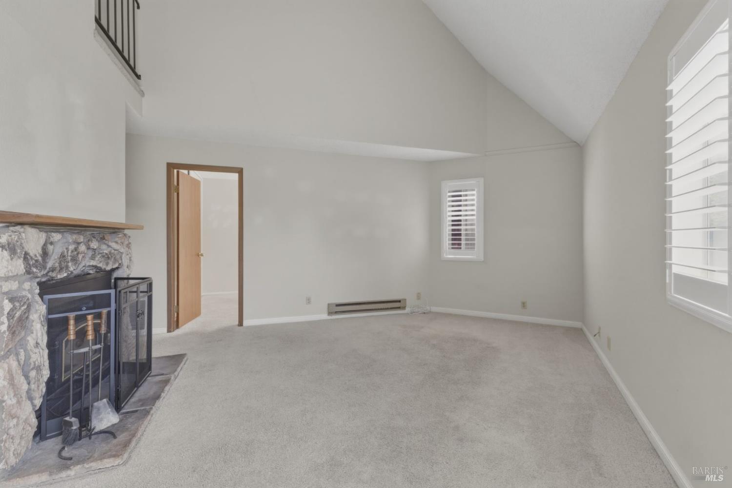 1565 Parkway Drive Rohnert Park, CA 94928 - Photo 2 of 42 a view of an empty room with a fireplace and a window