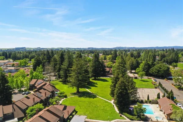 an aerial view of a house with outdoor space
