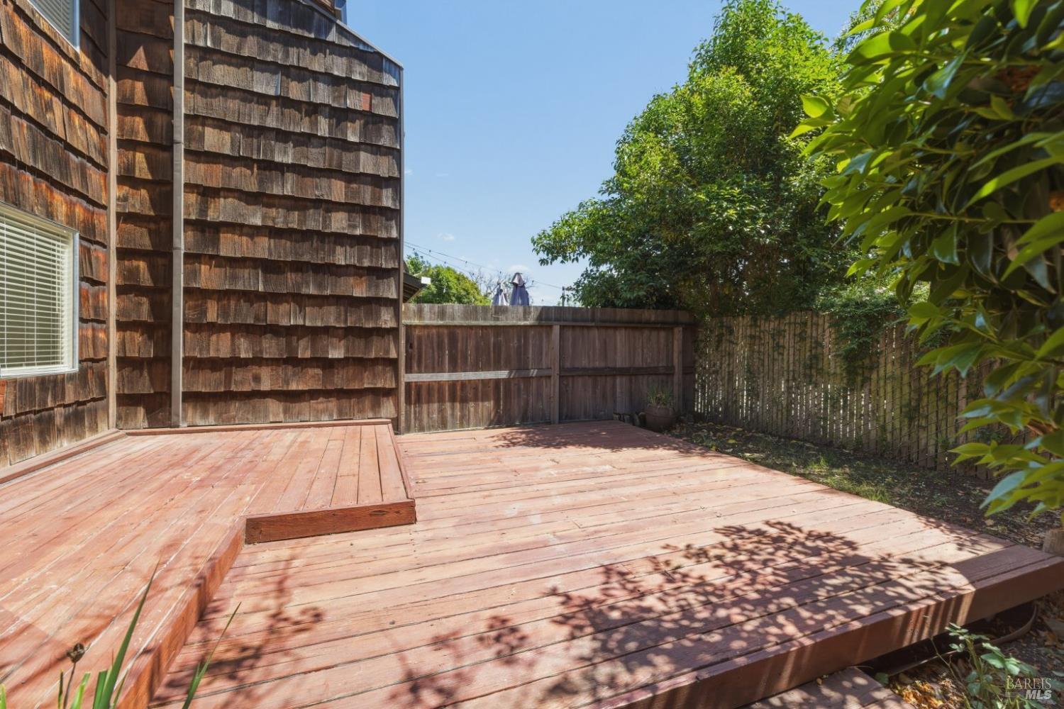 1565 Parkway Drive Rohnert Park, CA 94928 - Photo 6 of 42 a space with wooden fence and trees