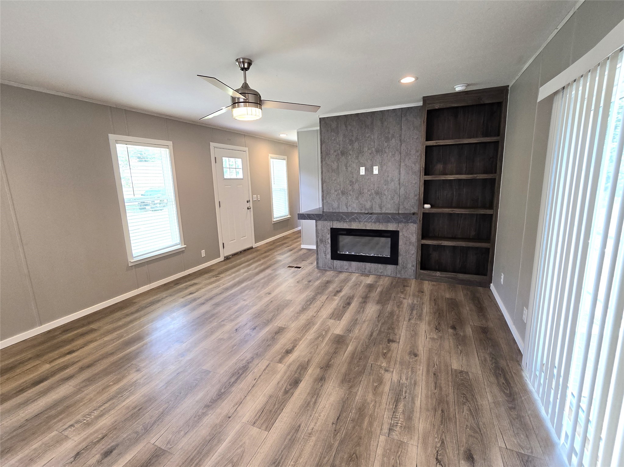 215 Buffalo Way Drive Trinity, TX 75862 - Photo 13 of 17 wooden floor in an empty room with a window