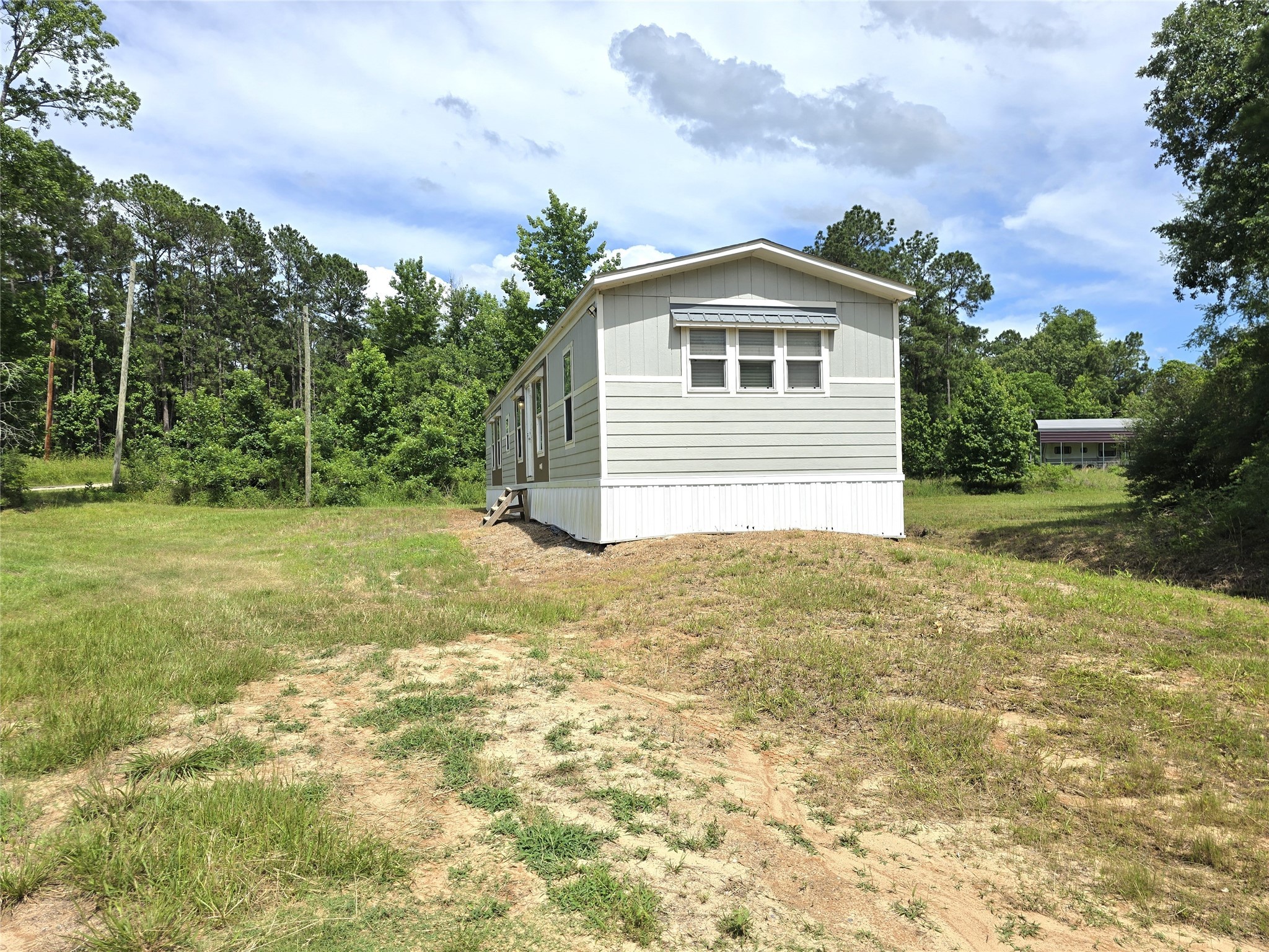 215 Buffalo Way Drive Trinity, TX 75862 - Photo 17 of 17 a view of a house with a yard