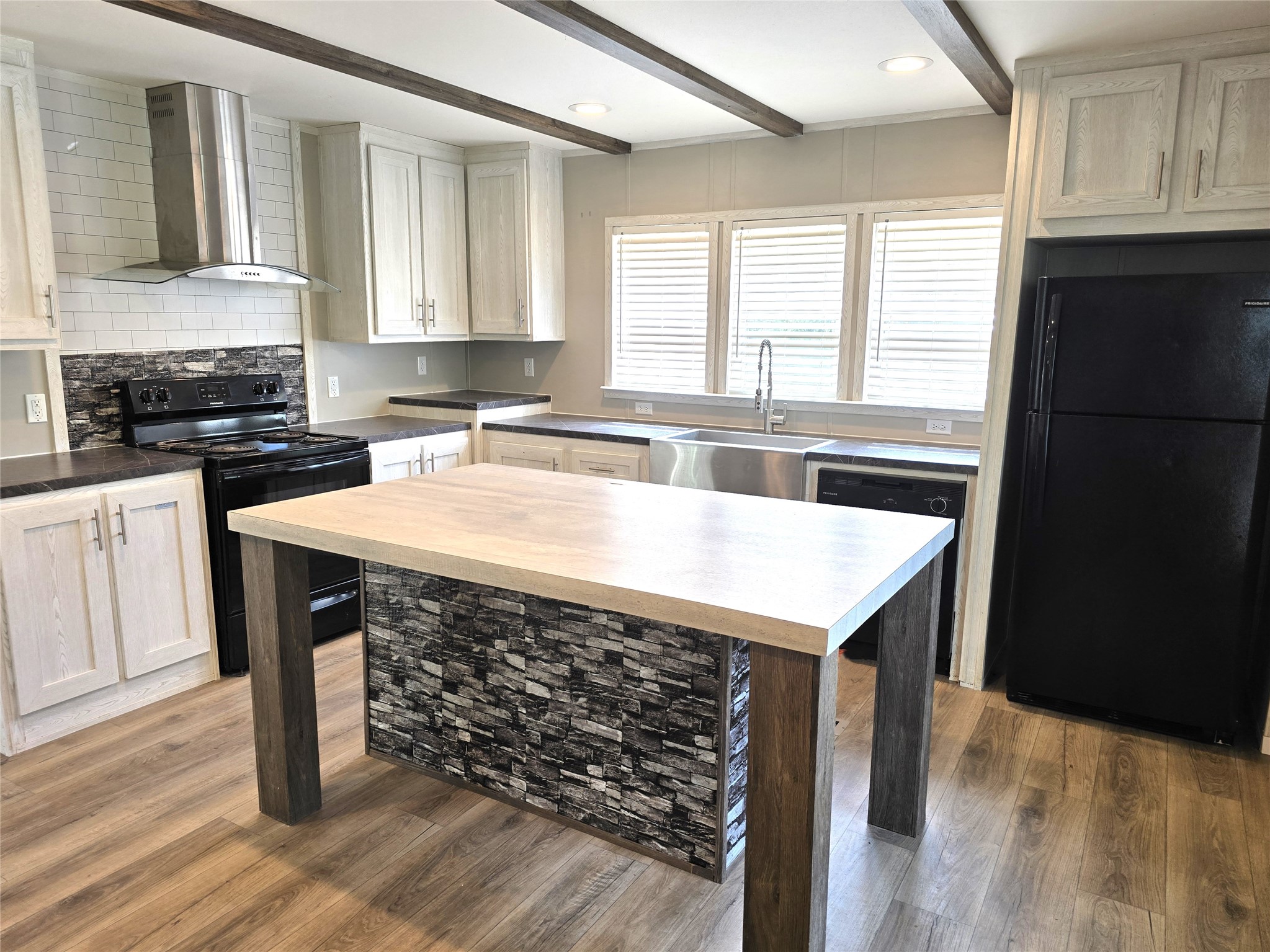 215 Buffalo Way Drive Trinity, TX 75862 - Photo 2 of 17 a kitchen with a sink cabinets and wooden floor