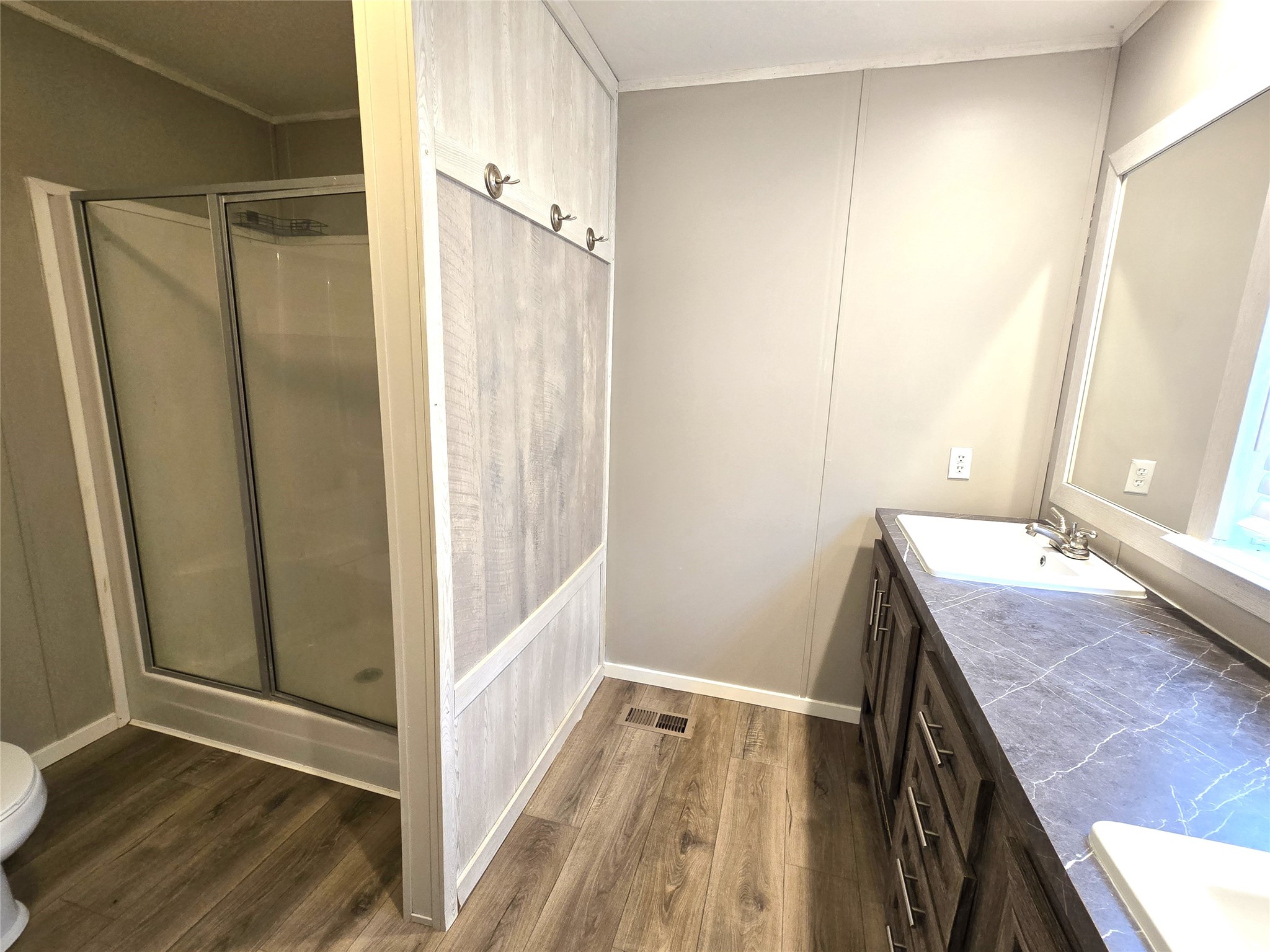 215 Buffalo Way Drive Trinity, TX 75862 - Photo 7 of 17 a bathroom with a granite countertop sink and a mirror