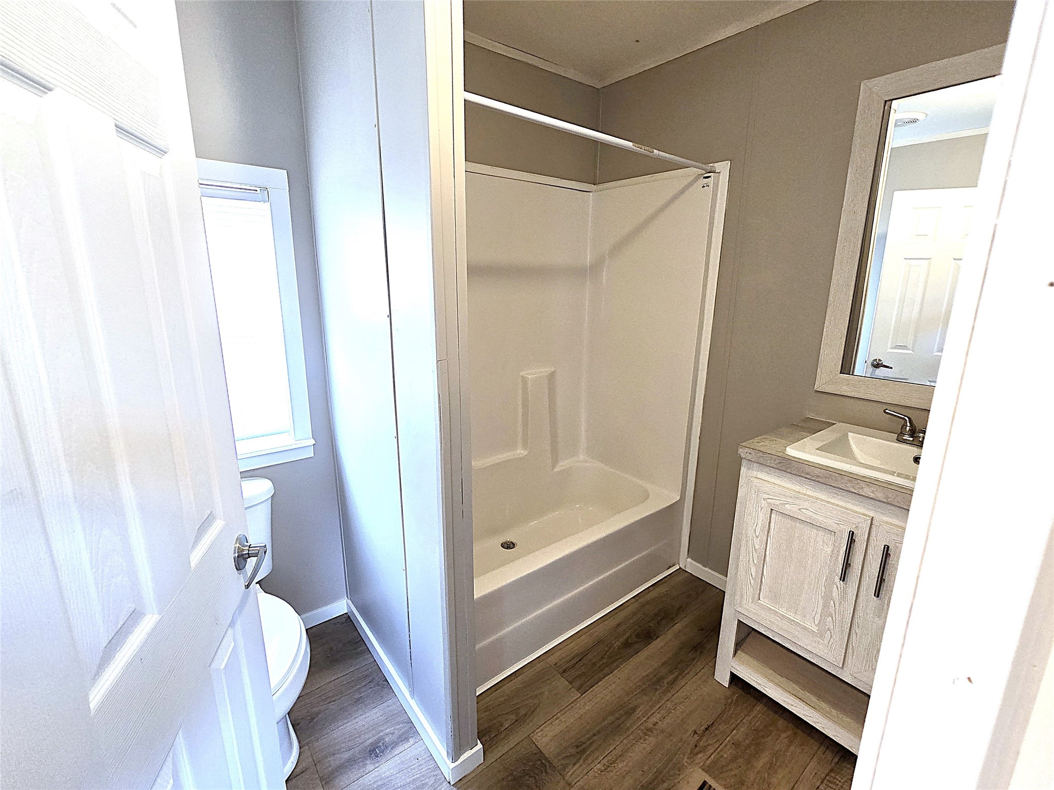 215 Buffalo Way Drive Trinity, TX 75862 - Photo 10 of 17 a bathroom with a tub shower and a sink