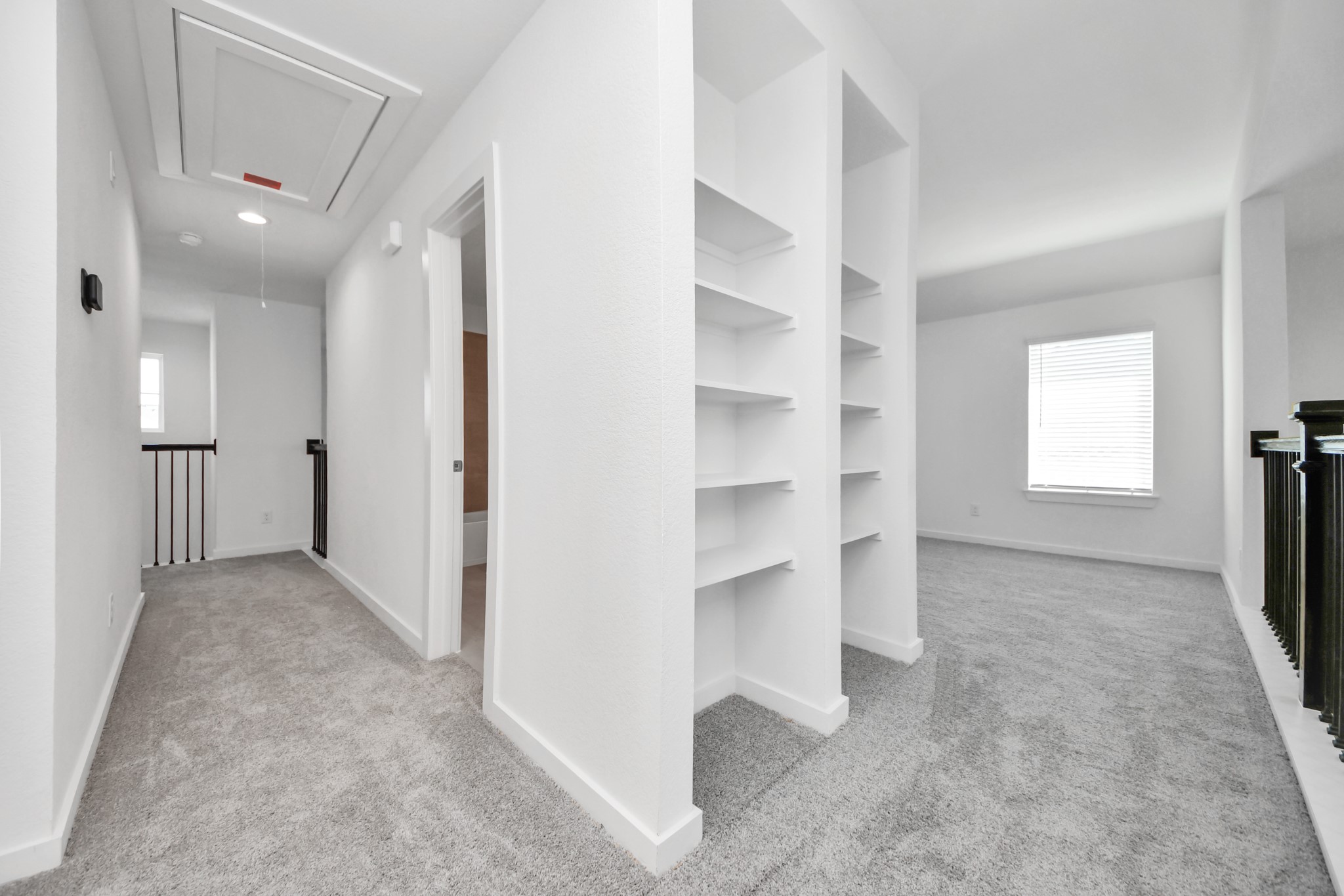 2926 Bury Park Dr Spring Spring, TX 77373 - Photo 27 of 40 Come upstairs and enjoy a day of leisure in this fabulous game room! This is the perfect hangout spot or adult game room! Features plush carpet, high ceilings, custom paint and windows for plenty of natural light.